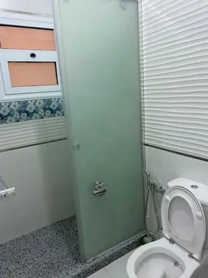a bathroom with a toilet with the lid up at Steven in Luxor