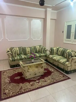 a living room with two couches and a table at Just the two of us in Luxor