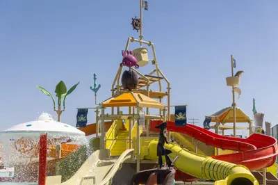 a group of water slides at a water park at Aldiana Club Naga Bay in Hurghada