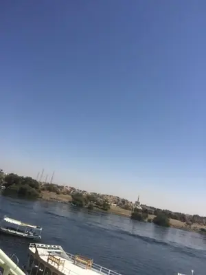 a river with two boats in the water at بيت ملكه house of malaka in Naj‘ al Maḩaţţah