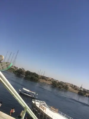 a boat is docked on a river at بيت ملكه house of malaka in Naj‘ al Maḩaţţah