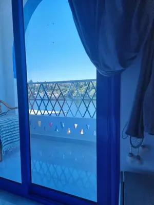 a room with a window with a view of a bridge at PANORAMIC BABA DOoL in Aswan