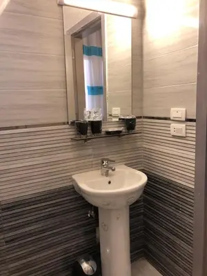 a bathroom with a sink and a mirror at Wadjet-inn in Hurghada