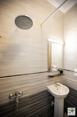 a bathroom with a sink and a mirror at Wadjet-inn in Hurghada