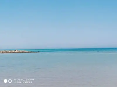 a picture of the ocean with a beach in the background at Tertels beach resort F 1-7 in Hurghada