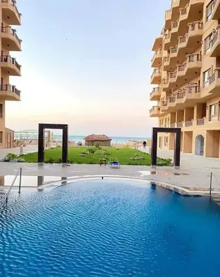 a large swimming pool in the middle of a building at Tertels beach resort F 1-7 in Hurghada
