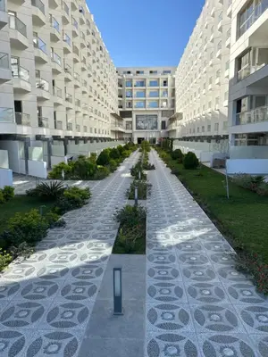 an empty street in a building with two large buildings at scandic resort 647 in Hurghada