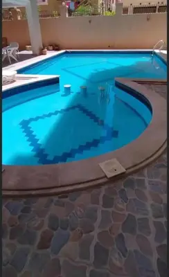 a large swimming pool with blue water at Farida in Hurghada