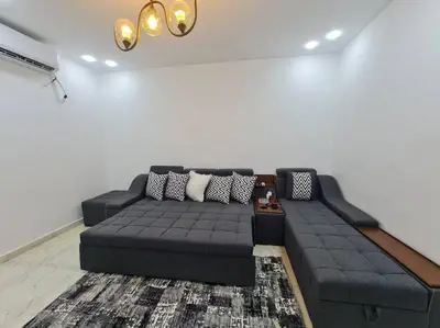 a living room with a couch in a room at Mabed in Hurghada