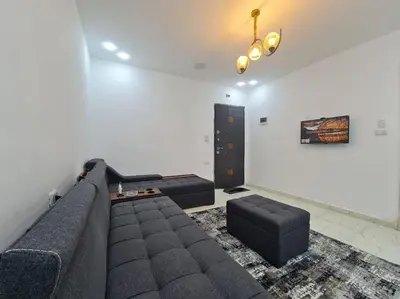 a living room with a couch and two couches at Mabed in Hurghada