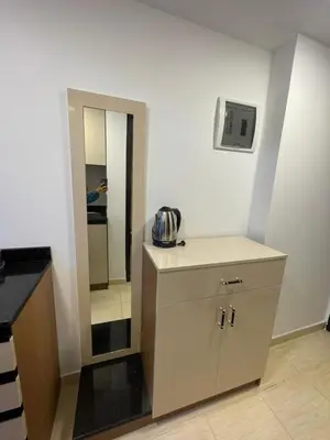 a kitchen with a sink and a mirror in a room at Florenza Resort- Hurghada in Hurghada
