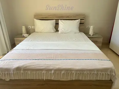 a bedroom with a large bed with white sheets and pillows at SunShine Mangrove in Hurghada