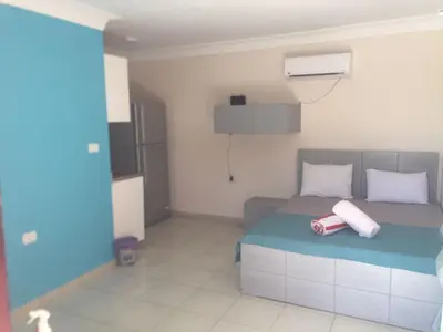 a bedroom with a bed with two towels on it at hurgada hapy room in Hurghada