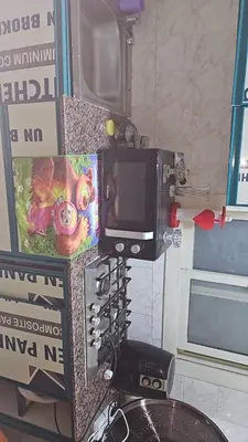 a room with a tv on a wall at Hurghada red ruby in Hurghada