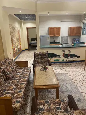 a living room with a couch and a table at Eye of Horus House in Luxor