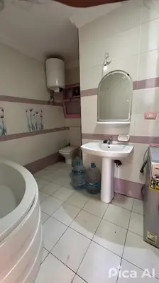 a bathroom with a toilet and a sink at The best view of the Nile in Naj‘ al ‘Amrāb