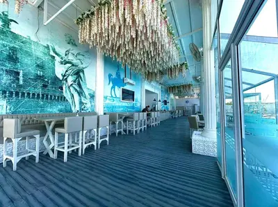 a dining room with chairs and a mural on the wall at Hurghada celina branch & resort in Hurghada