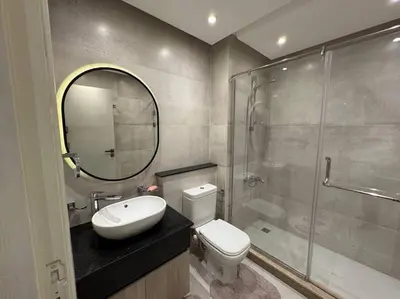 a bathroom with a toilet and a sink and a shower at Luxury Villa Hurghada Pool Near Senzo Mall 3story in Hurghada