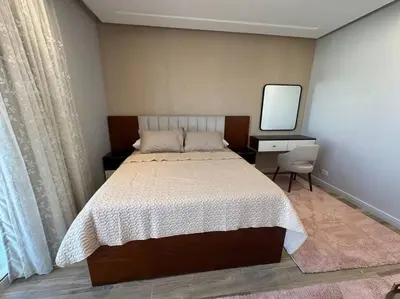a bedroom with a bed and a desk and a television at Luxury Villa Hurghada Pool Near Senzo Mall 3story in Hurghada