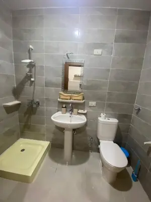 a bathroom with a toilet and a sink at Tiba Golden Resort in Hurghada