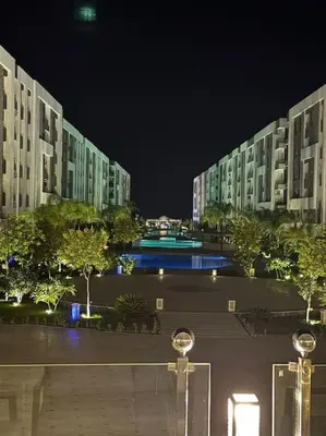 a large apartment building with a courtyard at night at Red Sea Hurghada Summer in Winter in Hurghada