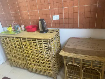 a kitchen with a table and two baskets and a kettle on top at Nile Temple view in Luxor