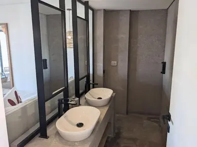 a bathroom with a sink and a toilet and a shower at Magical Cabana Steps From Beach & Pool in Hurghada