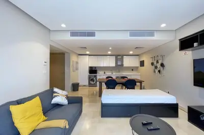 a living room with a bed and a couch at Minimal & Mere 1 BDR Mangroovy Free Beach & Pool in Hurghada