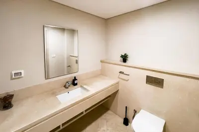 a bathroom with a sink and a mirror at Scenic Pool Front 1 BDR Mangroovy Free Pool & Beach in Hurghada