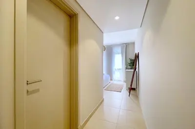 a hallway with a door leading to a room at Embellished 2BDR Penthouse Mangroovy Free Pool & Beach in Hurghada