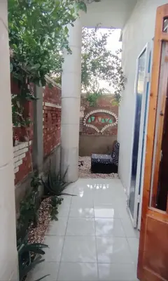 a courtyard with a bench in a house at Pro Luxor guest house in Luxor