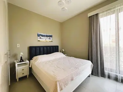 a bedroom with a large bed and a window at Luminous 4BR Villa, Free Pool & Lagoon Access At Gouna in Hurghada
