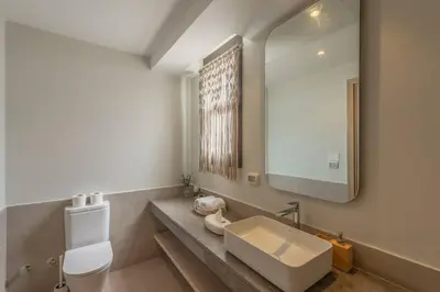 a bathroom with a sink and a mirror at Charming 2-Lvl 3BR Lagoon Home in Shedwan El Gouna, Pool Access in Hurghada