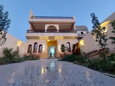 an image of a house with a driveway at Carter Guesthouse Luxor 2 in ‘Ezbet Abu Ḥabashi