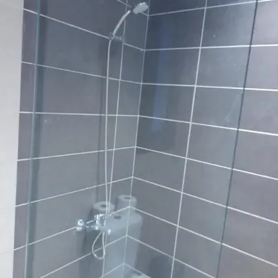 a shower with a shower head in a bathroom at Studio El Gouna G Cribs Hotel in Hurghada