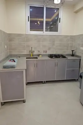 a kitchen with stainless steel appliances and a window at LUXOR DREAM - Panoramic Villa in Luxor
