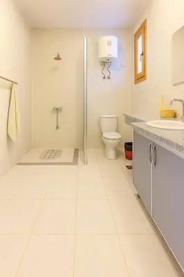 a bathroom with a shower and a toilet and a sink at LUXOR DREAM - Panoramic Villa in Luxor