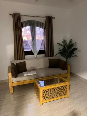 a living room with a couch and a window at Villa Muhammad in Quseir