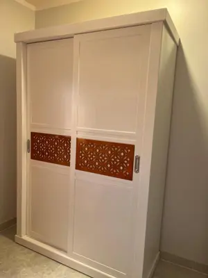 a white garage door with brown trim at Villa Muhammad in Quseir