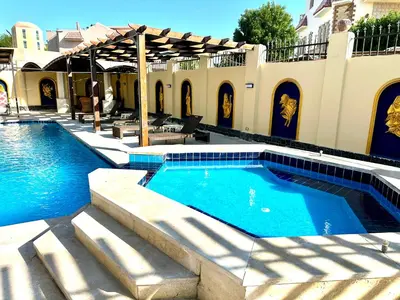 a swimming pool in the middle of a house at Private villa in Hurghada in Hurghada