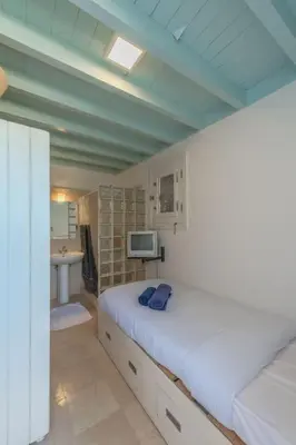 a bedroom with a large bed and a bathroom at Luxury apartment on the Marina in Hurghada