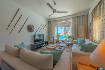 a living room with a couch and a table at Luxury apartment on the Marina in Hurghada