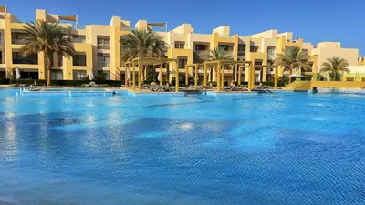 a large swimming pool in front of a building at M Residence with Pool View & Beach Access - El Gouna, Hurghada in Hurghada