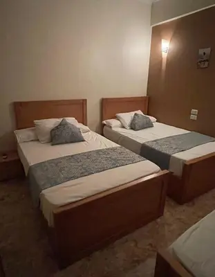 two beds in a hotel room with two beds at Luxe Nest Luxor Serviced Apartments 101 in Luxor