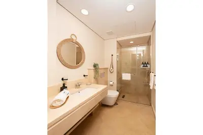 a bathroom with a sink and a toilet and a shower at Secluded & Bespoke 1 BDR Apt with Pool View & Beach access in Hurghada
