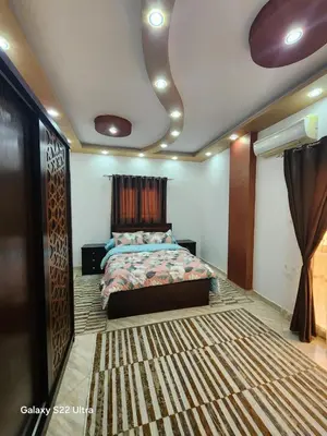 a bedroom with a bed in a room at Abeer Suites 5 in Hurghada