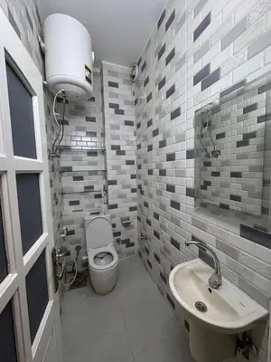 a bathroom with a toilet and a sink at BePy's NUBIAN HOUSE in Aswan