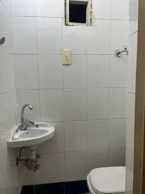 a bathroom with a sink and a toilet at Shamandy house same same but different in Jazīrat Aswān
