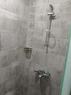 a bathroom with a shower with a shower head at Scandic Resort Hurghada Red Sea in Hurghada