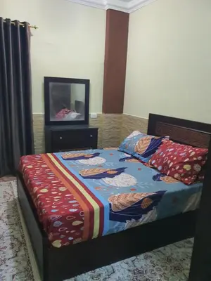 a bedroom with a bed and a television in it at Abeer Suites 4 basement in Hurghada